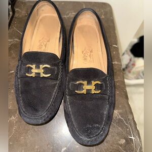 Salvatore Ferragamo loafer.  Black with gold hardware.